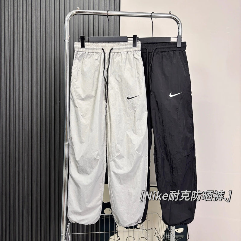 N*KE TRACK PANTS